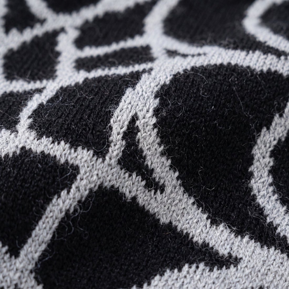 Close up of the spider web knitted into the beanie