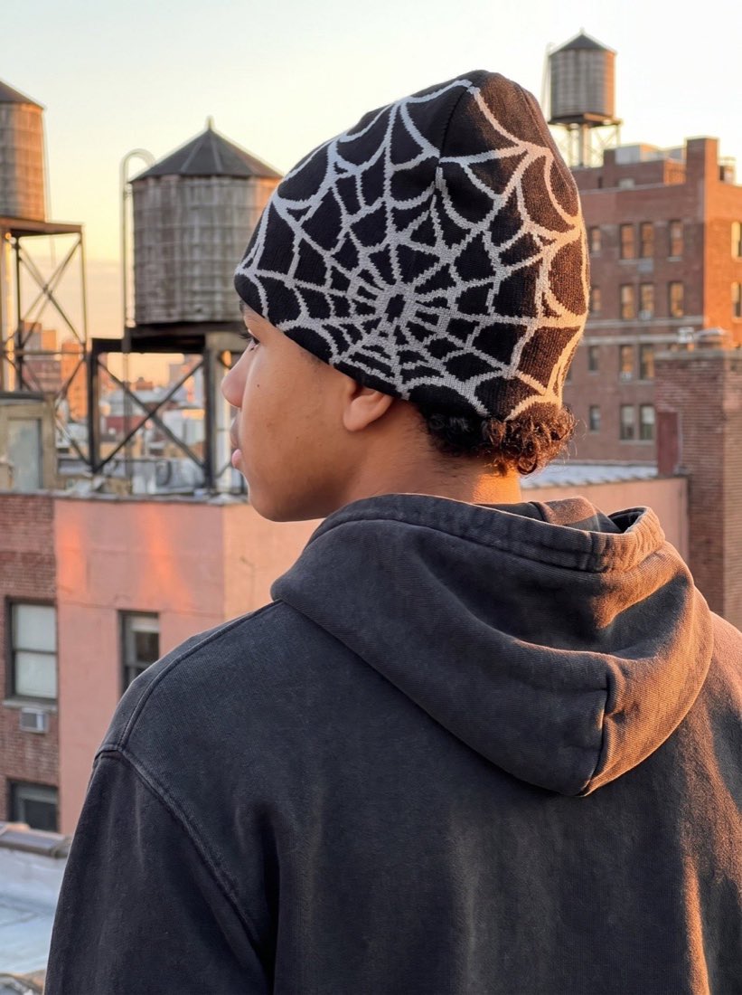 Web Knit Beanie worn on a rooftop